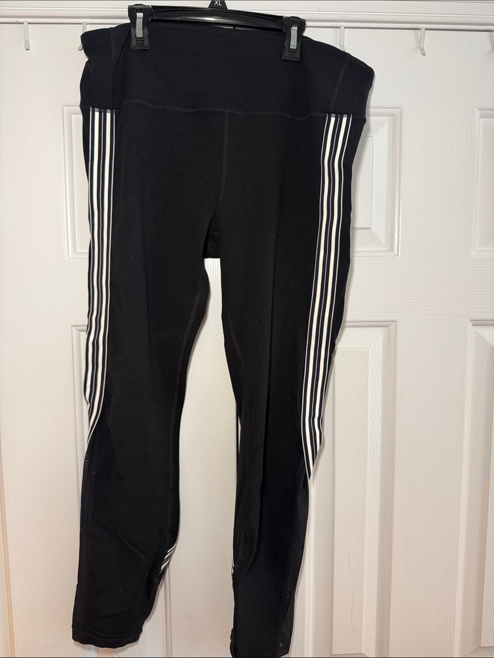 Athleta Black Leggings with White Side Stripes and mesh at bottom